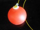 red ball on string